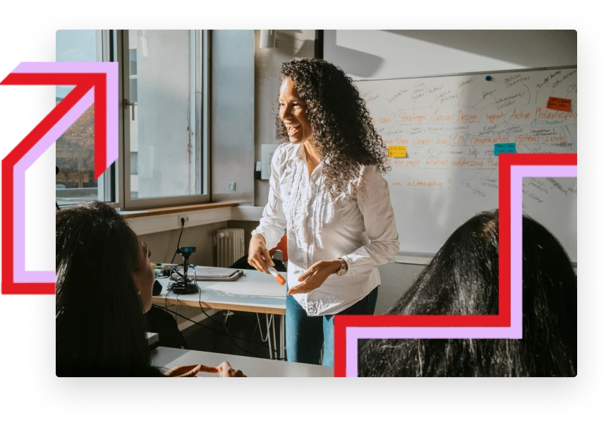Image of a teacher in front of the classroom imparting a lesson to her students