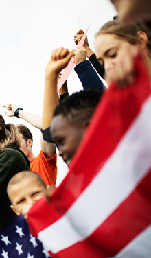 kids holding an american flag