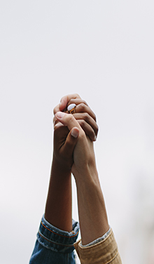 hands being held together in the air